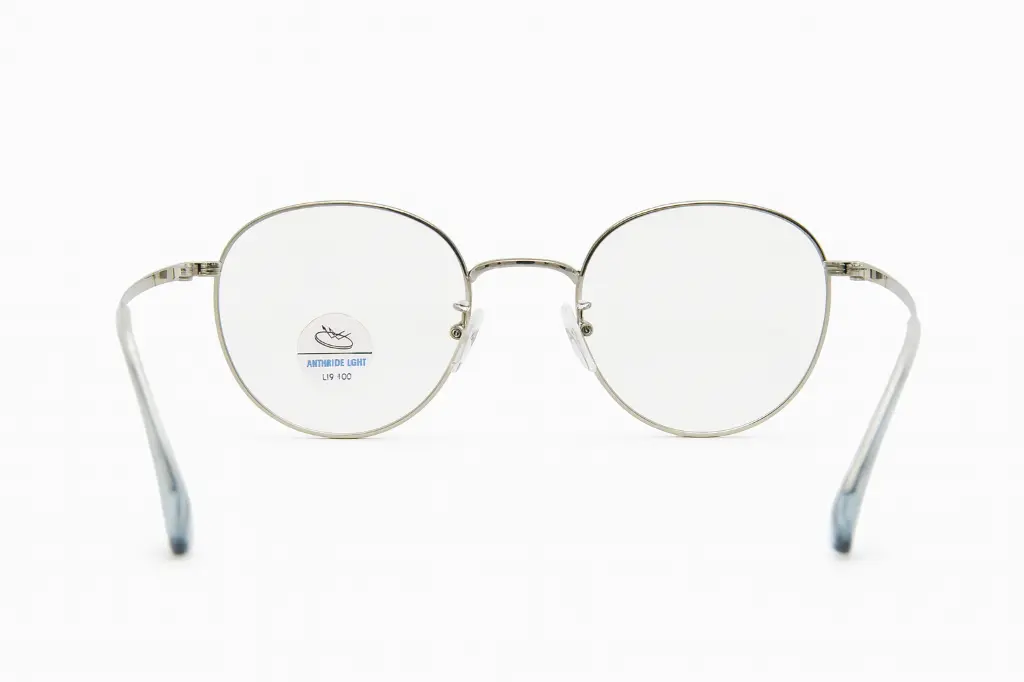 Monture ronde métal homme Titanium élégante – Showroom Luxe Optique Dakar.webp